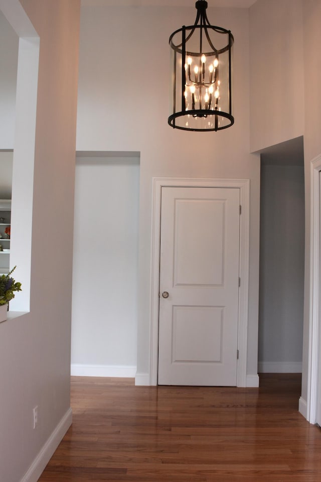 55 Blue Castle Dr, Mashpee, MA 02649 - entrance foyer featuring wood finished floors, a chandelier, and baseboards