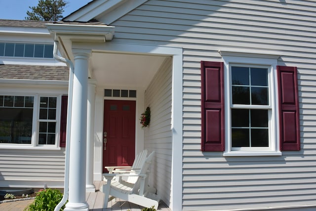 55 Blue Castle Dr, Mashpee, MA 02649 - property entrance featuring roof with shingles