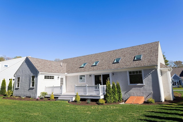 55 Blue Castle Dr, Mashpee, MA 02649 - back of house featuring a wooden deck, a yard, and roof with shingles