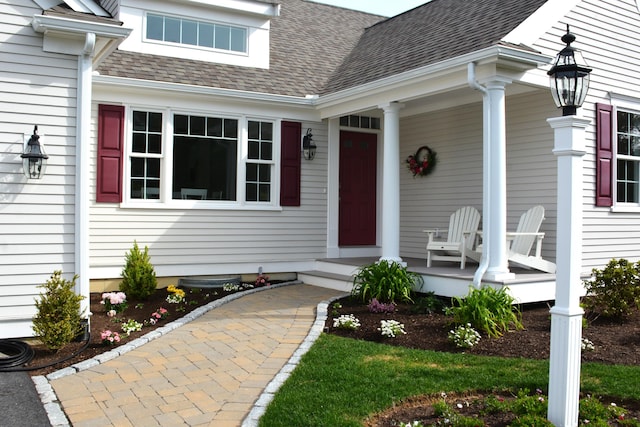 55 Blue Castle Dr, Mashpee, MA 02649 - entrance to property featuring a porch and roof with shingles