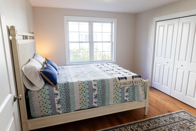 55 Blue Castle Dr, Mashpee, MA 02649 - bedroom featuring wood finished floors and a closet