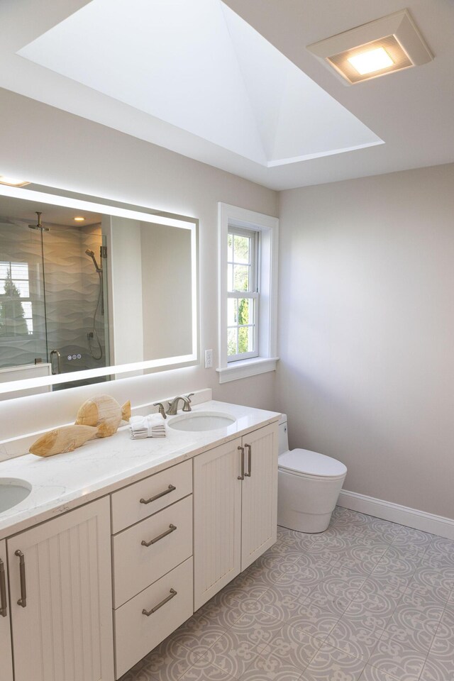 55 Blue Castle Dr, Mashpee, MA 02649 - full bath featuring a shower stall, double vanity, toilet, baseboards, and vaulted ceiling