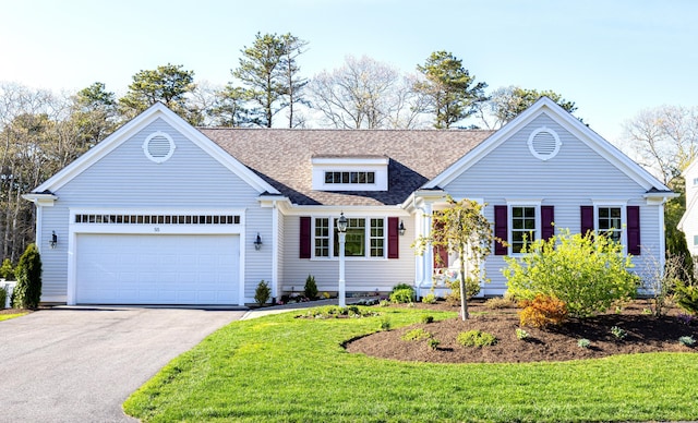 55 Blue Castle Dr, Mashpee, MA 02649 - view of front of home featuring driveway, roof with shingles, a garage, and a front lawn