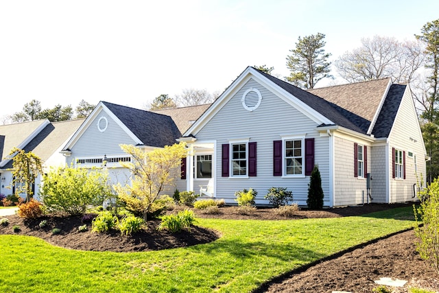 55 Blue Castle Dr, Mashpee, MA 02649 - view of front facade with a front yard and roof with shingles