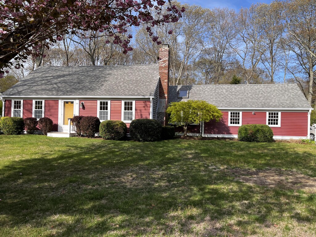 34 Kiahs Way E, Sandwich, MA 02537 - view of front facade with roof with shingles, a front yard, and a chimney