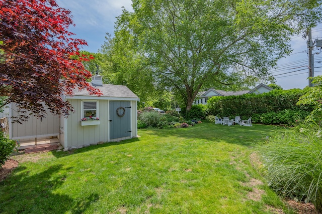 5 Putnam Ave, Cotuit, MA 02635 - view of grassy yard with a storage unit