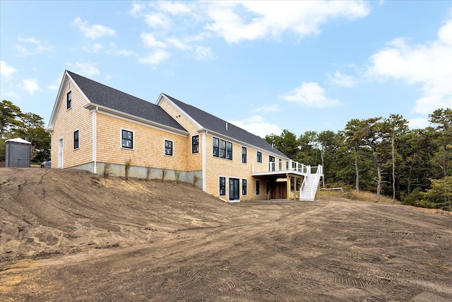 view of side of home with a wooden deck