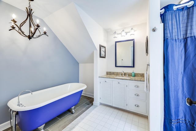 46 Juniper Ln W, South Chatham, MA 02659 - full bathroom featuring an inviting chandelier, vanity, a freestanding tub, a shower with curtain, and vaulted ceiling