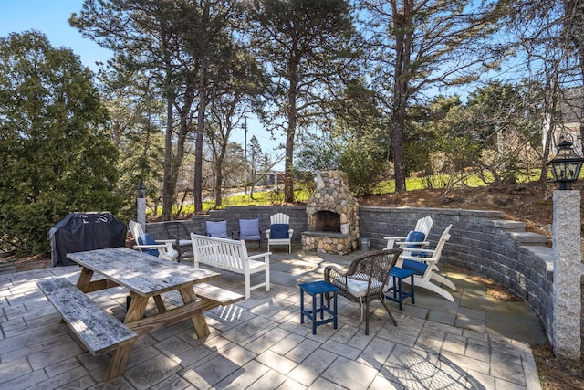 46 Juniper Ln W, South Chatham, MA 02659 - view of patio with an outdoor stone fireplace and area for grilling