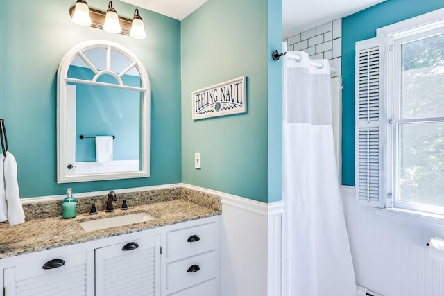 46 Juniper Ln W, South Chatham, MA 02659 - full bathroom with vanity, a wainscoted wall, and a shower with curtain