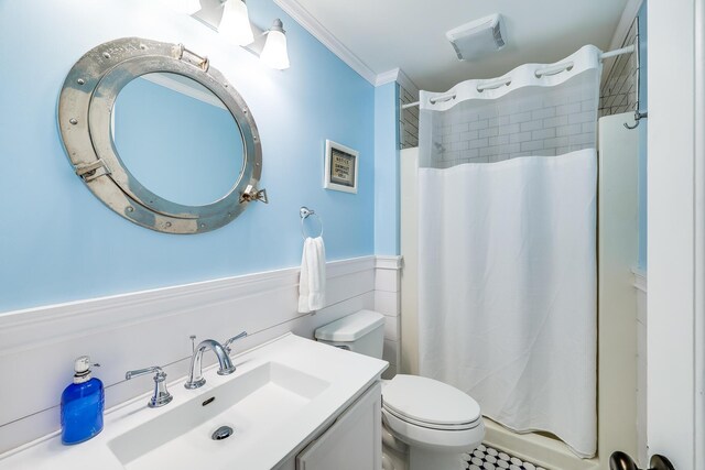 46 Juniper Ln W, South Chatham, MA 02659 - full bath with visible vents, vanity, wainscoting, toilet, and a shower with curtain