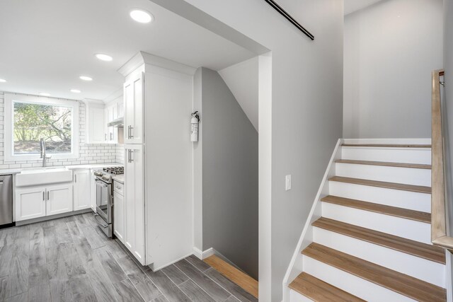 46 Juniper Ln W, South Chatham, MA 02659 - stairs featuring recessed lighting, baseboards, and wood finished floors