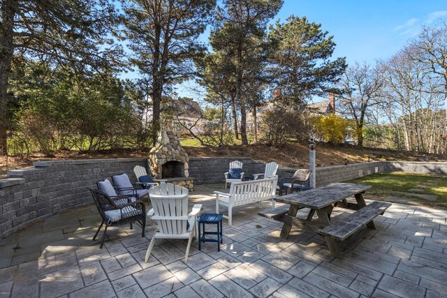46 Juniper Ln W, South Chatham, MA 02659 - view of patio / terrace with an outdoor stone fireplace and outdoor dining area