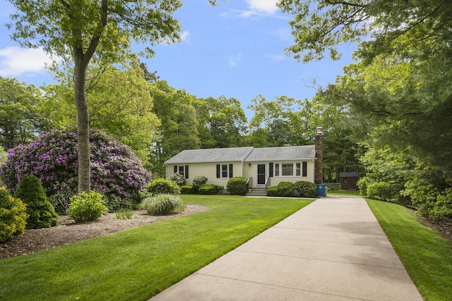 29 Braeburn Ct, Hatchville, MA 02536 - view of front of property with a chimney and a front lawn