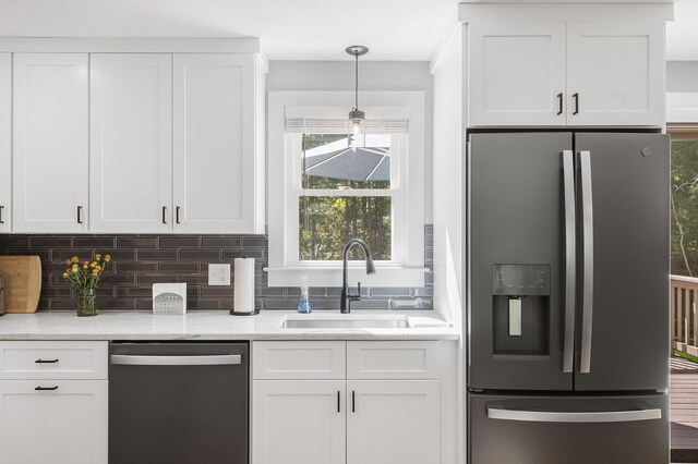 29 Braeburn Ct, Hatchville, MA 02536 - kitchen featuring stainless steel refrigerator with ice dispenser, dishwasher, a sink, and white cabinets
