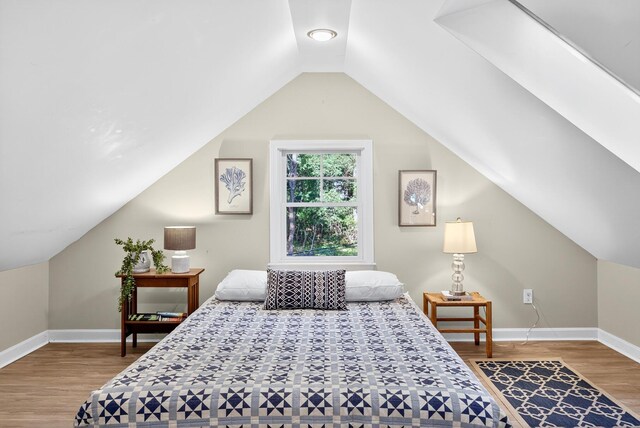 50 Piper Ln, Eastham, MA 02642 - bedroom featuring wood finished floors and lofted ceiling