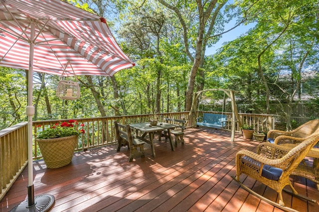 50 Piper Ln, Eastham, MA 02642 - deck featuring outdoor dining area and view of wooded area