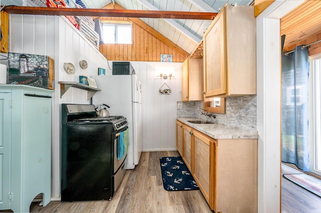 kitchen with sink, light hardwood / wood-style flooring, vaulted ceiling with beams, stainless steel range with electric cooktop, and a healthy amount of sunlight