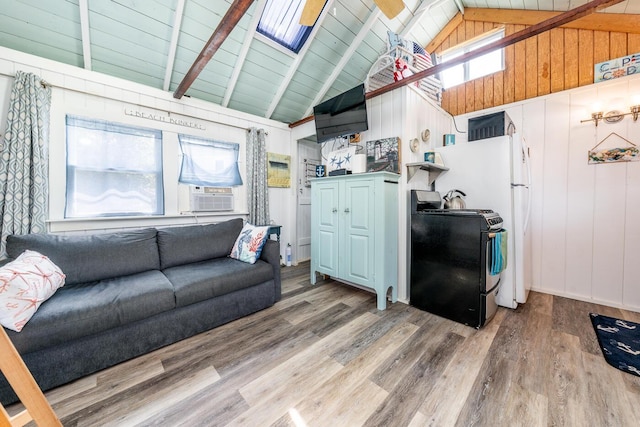 living room with wood-type flooring, cooling unit, wooden walls, high vaulted ceiling, and beam ceiling