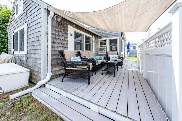 deck featuring outdoor lounge area