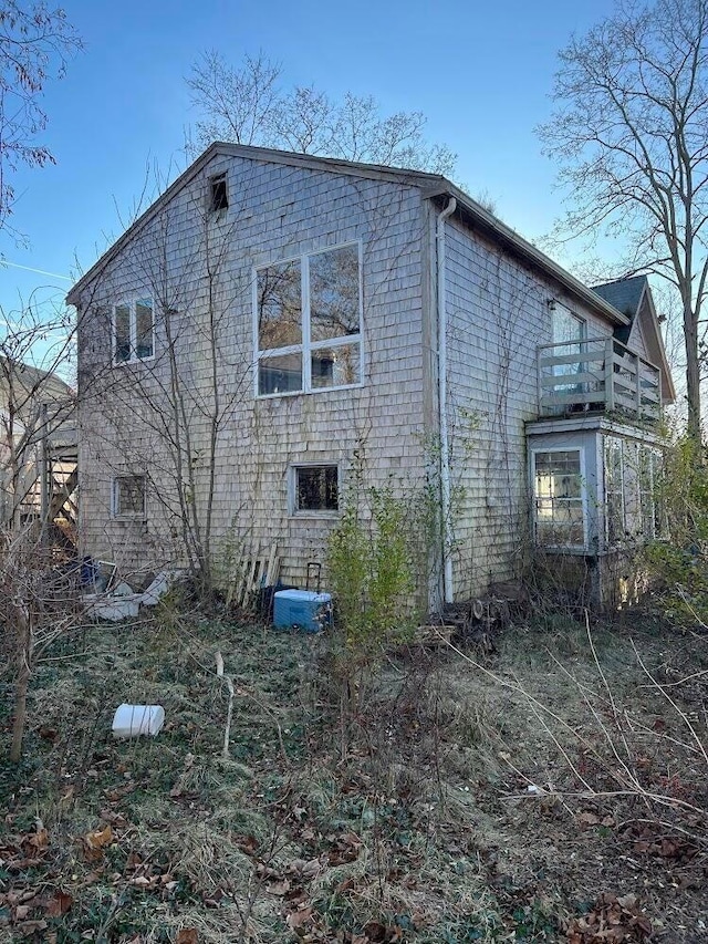 view of side of home featuring a balcony