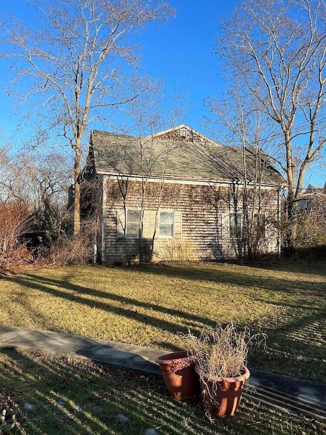 view of home's exterior featuring a yard