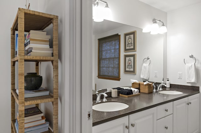 bathroom featuring double vanity and a sink