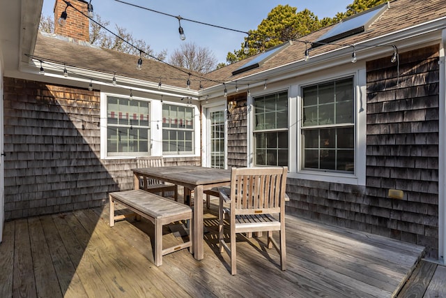 deck with outdoor dining area