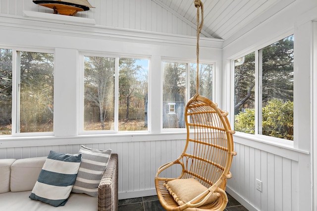 sunroom / solarium featuring lofted ceiling and a wealth of natural light