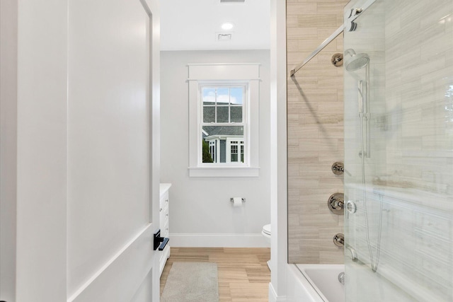 22 Country Club Ln, Mashpee, MA 02649 - full bathroom featuring wood finished floors, shower / bath combination with glass door, baseboards, toilet, and visible vents