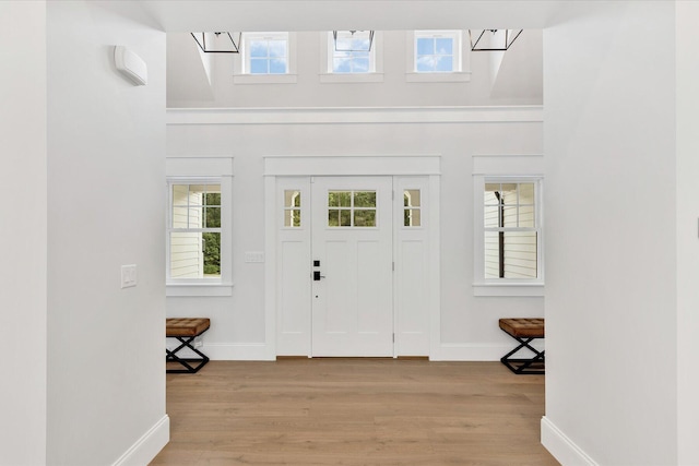 22 Country Club Ln, Mashpee, MA 02649 - entryway with light wood finished floors, baseboards, and a wealth of natural light