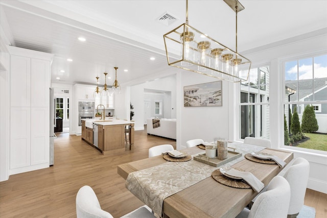 22 Country Club Ln, Mashpee, MA 02649 - dining area with recessed lighting, light wood-type flooring, visible vents, and an inviting chandelier