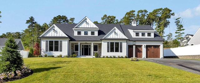 22 Country Club Ln, Mashpee, MA 02649 - view of front facade featuring driveway, fence, roof with shingles, and a front yard