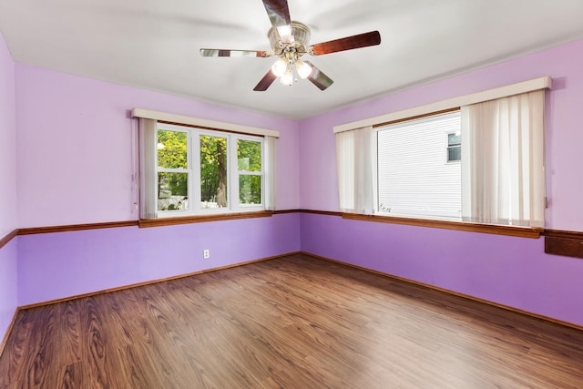 88 Hilltop St, Milton, MA 02186 - spare room with a ceiling fan, wood finished floors, and baseboards