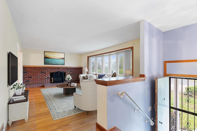 88 Hilltop St, Milton, MA 02186 - living room with light wood-style flooring and a brick fireplace
