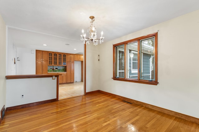 88 Hilltop St, Milton, MA 02186 - unfurnished room featuring baseboards, light wood-style flooring, and recessed lighting