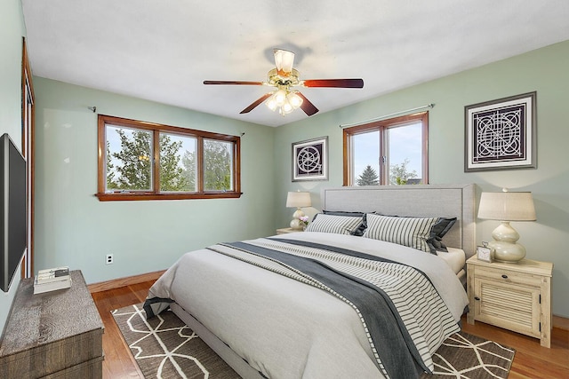 88 Hilltop St, Milton, MA 02186 - bedroom with multiple windows, wood finished floors, and baseboards