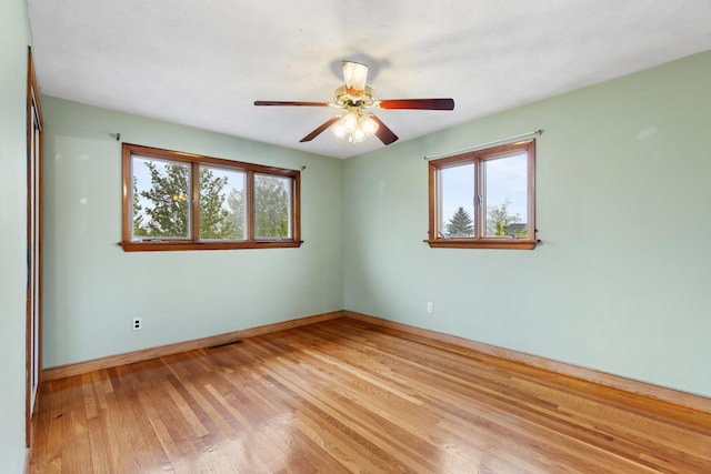 88 Hilltop St, Milton, MA 02186 - spare room featuring plenty of natural light, light wood-style flooring, ceiling fan, and baseboards