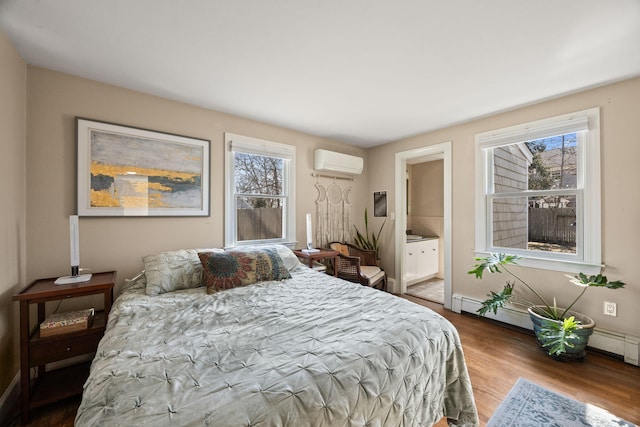 bedroom with multiple windows, a baseboard radiator, a wall mounted AC, and wood finished floors