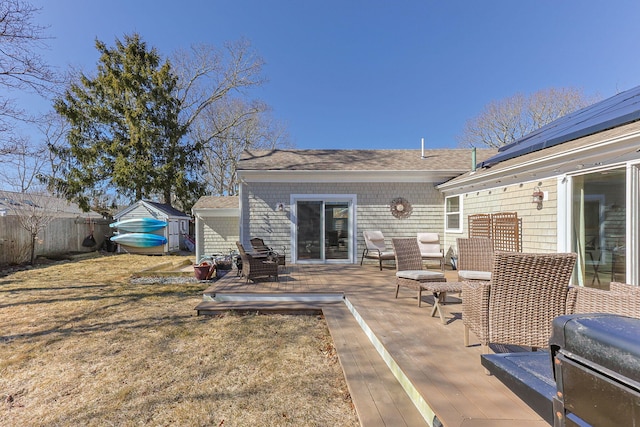 view of patio / terrace featuring a wooden deck and fence