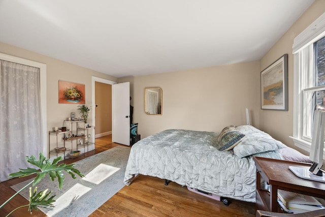 bedroom featuring wood finished floors