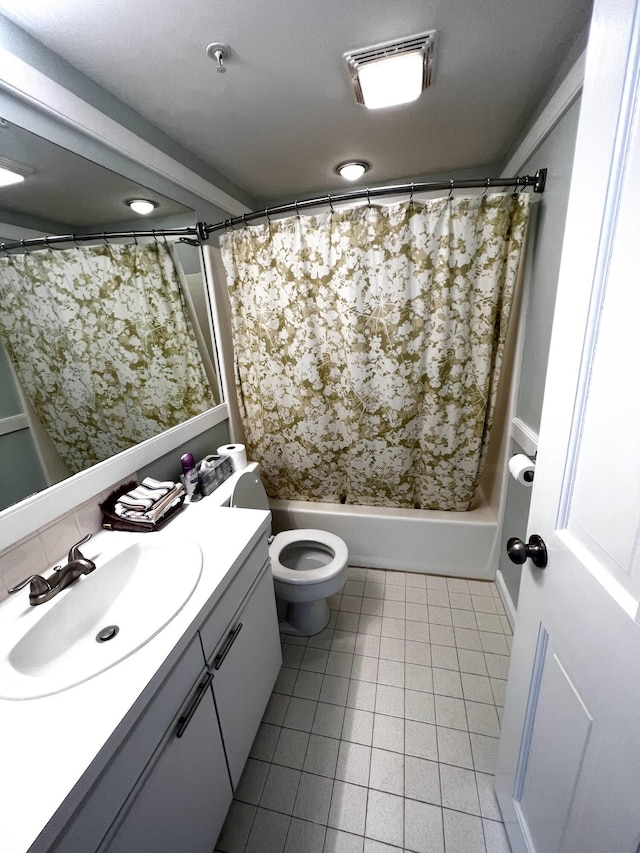 full bathroom featuring toilet, shower / tub combo, tile patterned flooring, and vanity