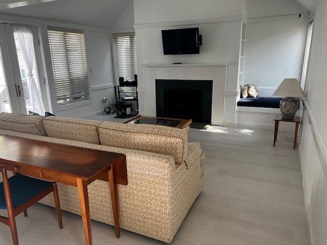 living room featuring vaulted ceiling