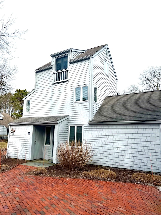 back of house with a patio