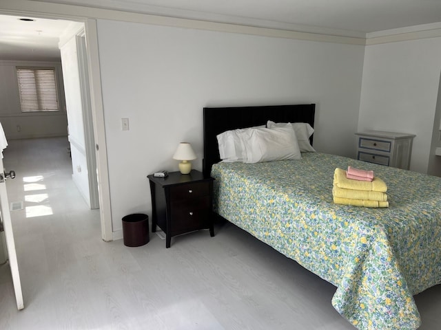 bedroom featuring light hardwood / wood-style flooring