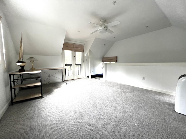 additional living space with ceiling fan, carpet, and lofted ceiling