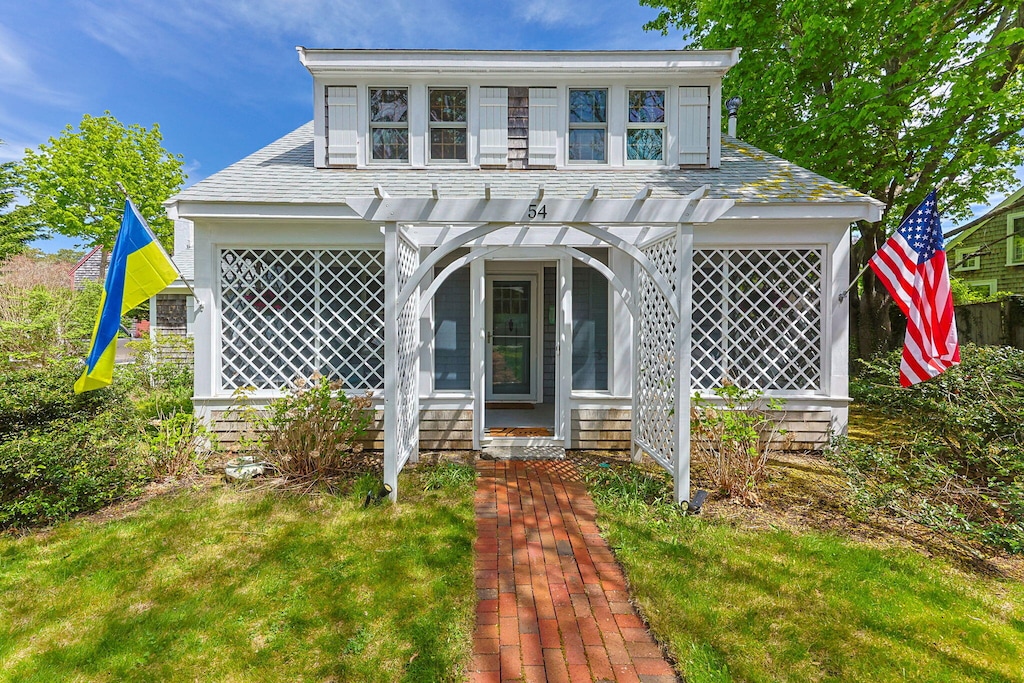 54 Smith St, West Harwich, MA 02671 - view of front facade featuring a porch and a front yard