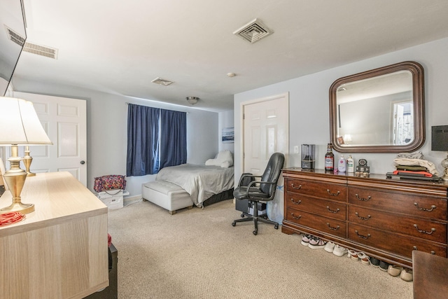 carpeted bedroom with visible vents