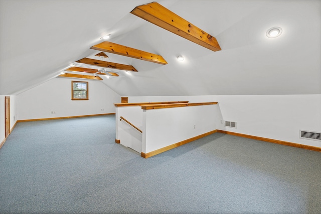 additional living space featuring lofted ceiling and carpet flooring