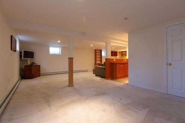 basement with recessed lighting, baseboard heating, light colored carpet, and baseboards